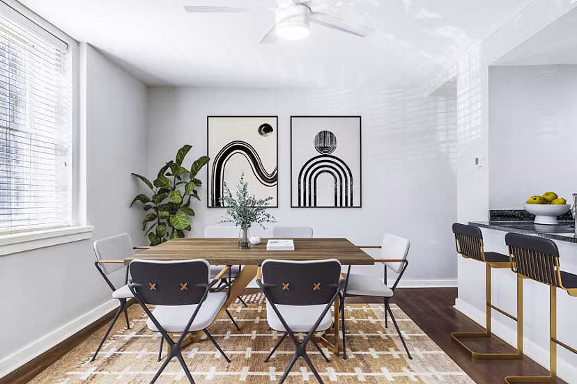 Dining room with elegant lighting and modern furniture at Quaker Court at University City Apartments