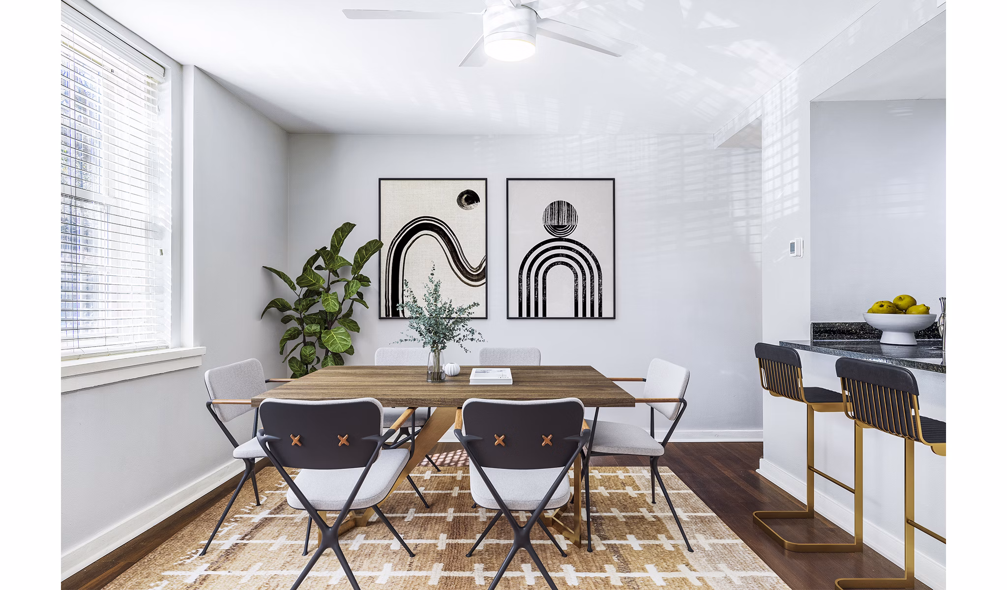 Dining room with elegant lighting and modern furniture at Quaker Court at University City Apartments
