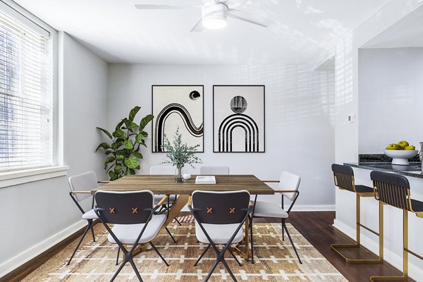 Dining room with elegant lighting and modern furniture at Quaker Court at University City Apartments