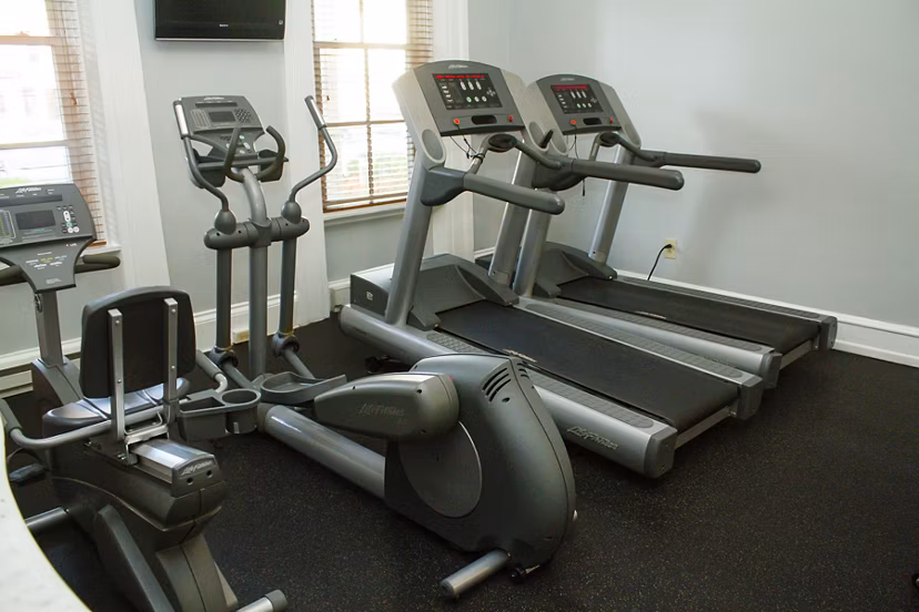 State-of-the-art fitness center with modern equipment at Old Quaker Building Apartments