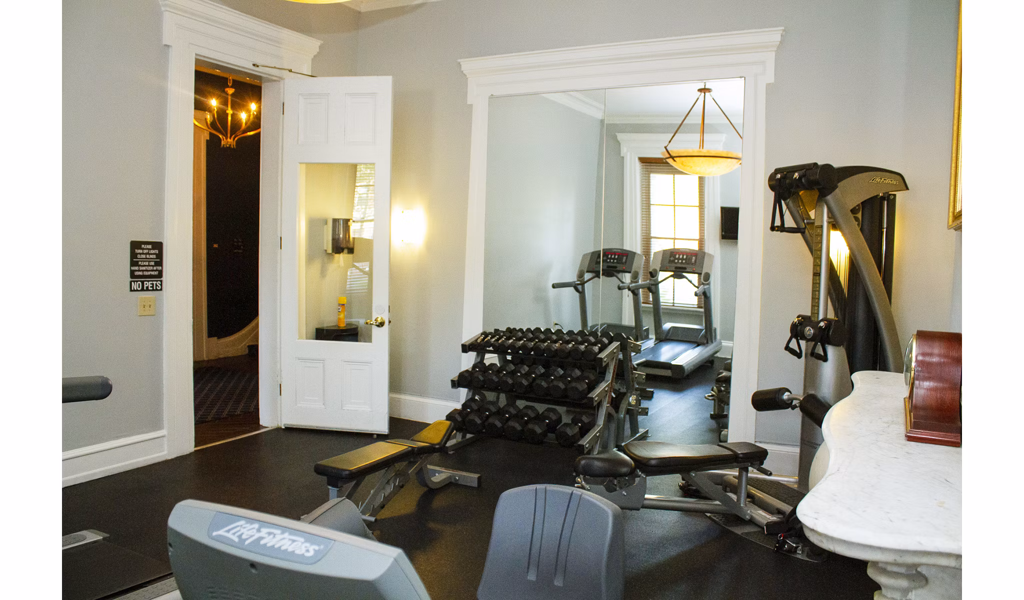 State-of-the-art fitness center at Old Quaker Building Apartments featuring modern equipment and spacious workout areas
