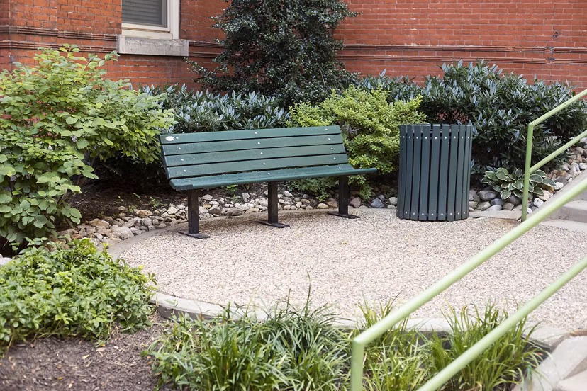 Charming courtyard surrounded by greenery at Old Quaker Building Apartments, a Greystar luxury property in the heart of Philadelphia