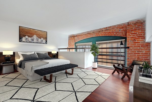 Cozy bedroom with modern decor at Logan Lofts luxury apartments