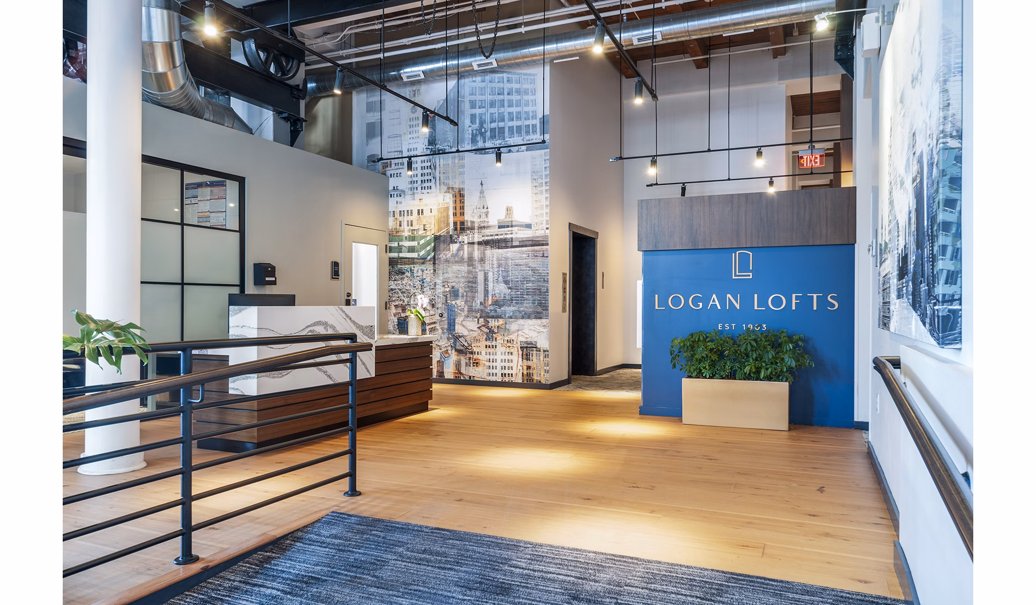 Modern clubhouse lobby with stylish seating at Logan Lofts Apartments, offering luxury spaces for residents to relax and gather