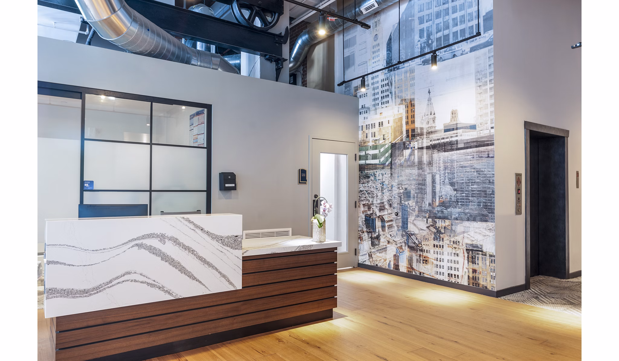 Clubhouse lobby with modern seating and stylish decor at Logan Lofts Apartments