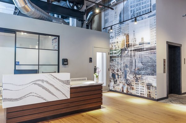 Clubhouse lobby with modern seating and stylish decor at Logan Lofts Apartments