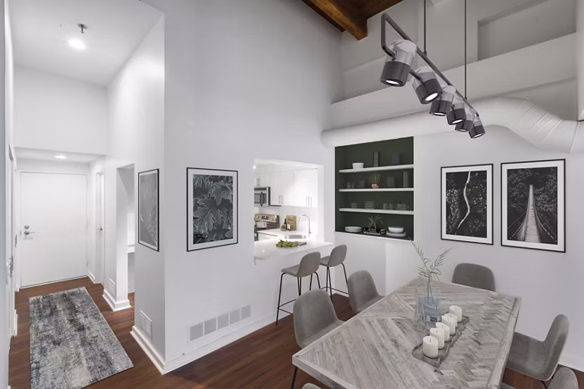 Dining area with modern fixtures and elegant seating at Logan Lofts luxury apartments, perfect for hosting gatherings and meals