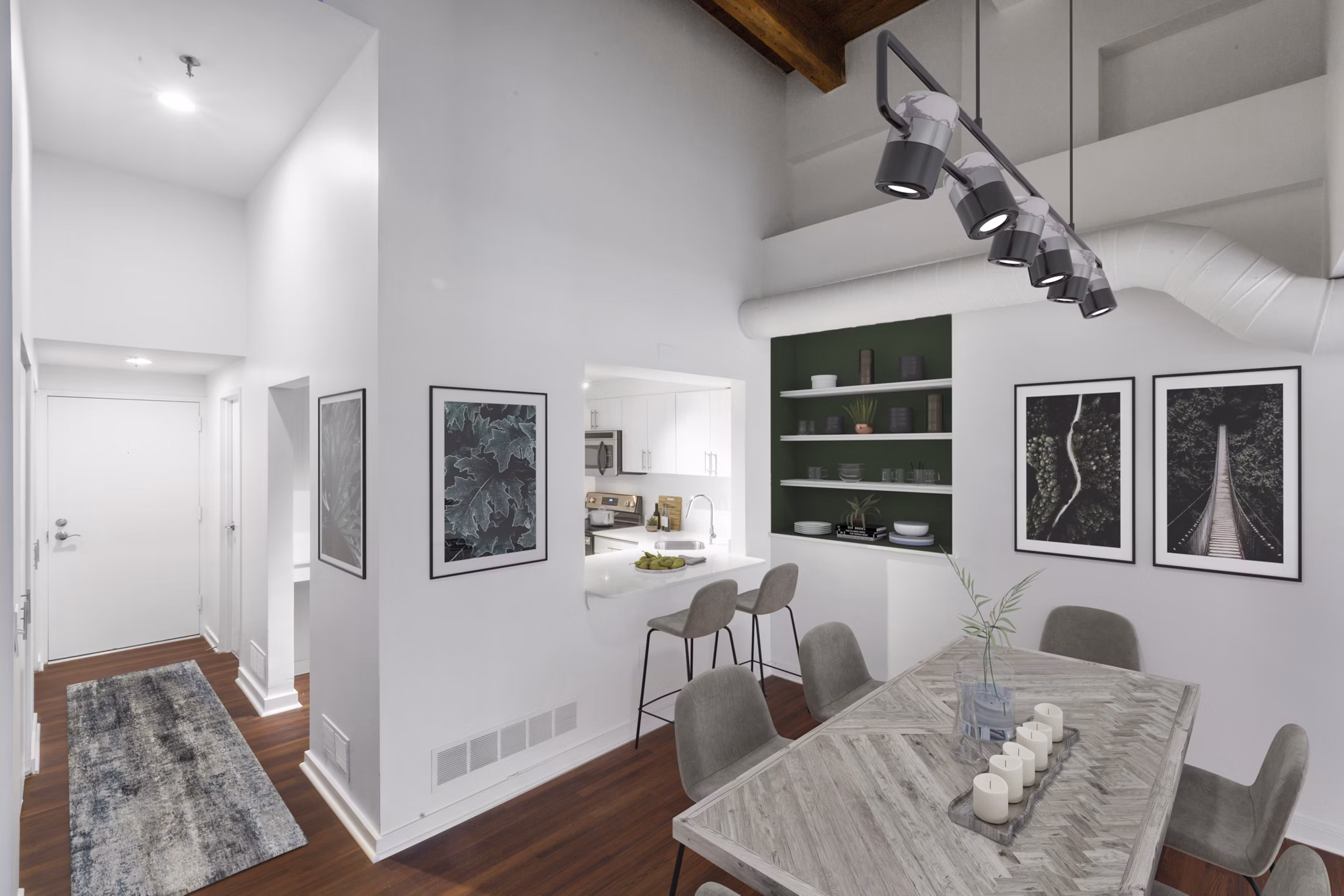 Dining area with modern fixtures and elegant seating at Logan Lofts luxury apartments, perfect for hosting gatherings and meals