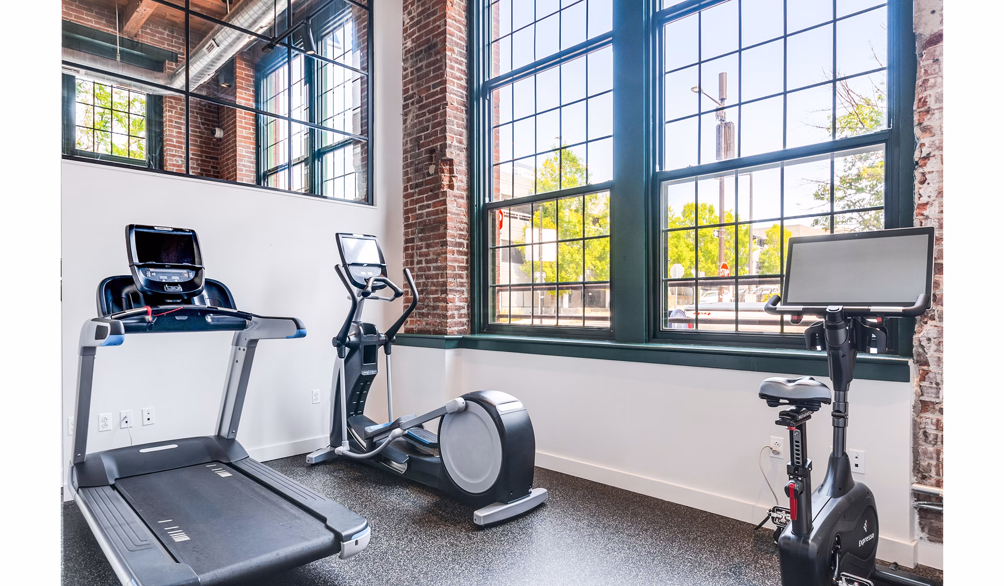 State-of-the-art fitness center with modern equipment at Logan Lofts Apartments