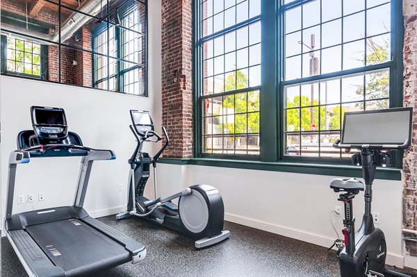 State-of-the-art fitness center with modern equipment at Logan Lofts Apartments