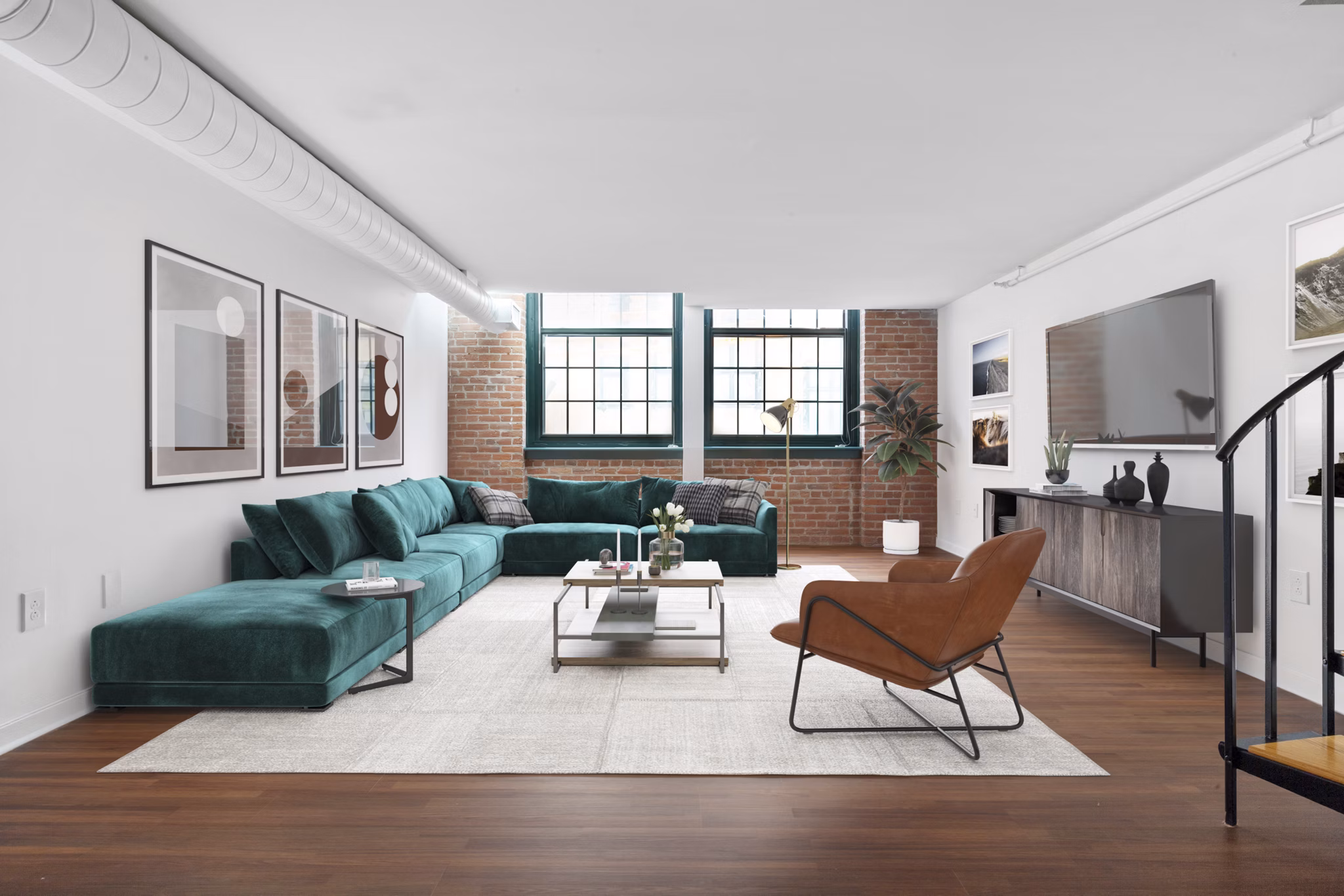 Modern living room with large windows and stylish furniture in Logan Lofts luxury apartments