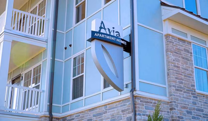 Contemporary signage at Avia Apartments, highlighting luxury living in a premier location