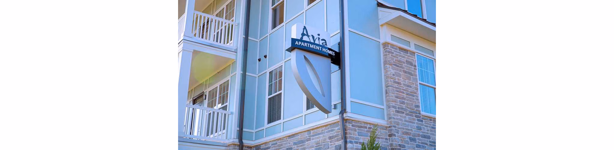 Contemporary signage at Avia Apartments, highlighting luxury living in a premier location