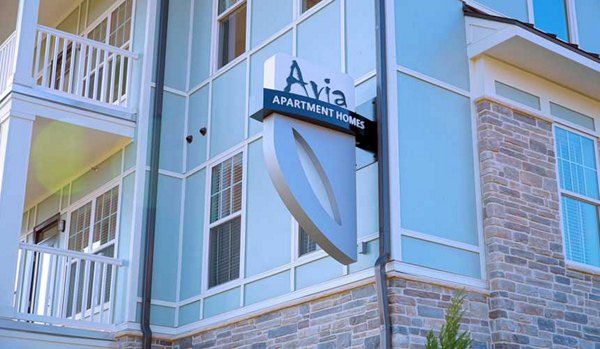 Contemporary signage at Avia Apartments, highlighting luxury living in a premier location