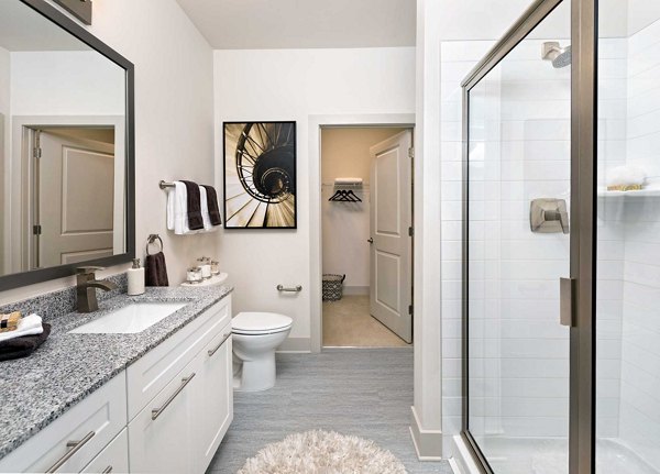 Modern bathroom with sleek fixtures at Avia Apartments featuring a luxurious design