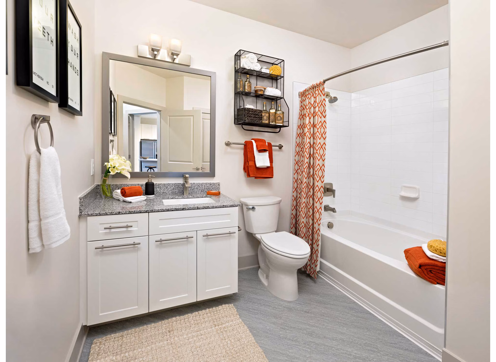 Luxurious bathroom with modern fixtures at Avia Apartments: contemporary luxury living in vibrant city setting