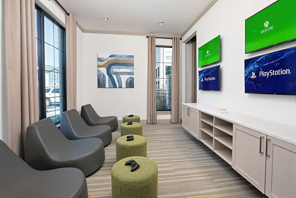 Clubhouse featuring modern decor and ample seating at Avia Apartments, a luxury Greystar property