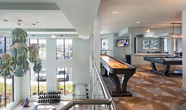 Modern clubhouse with communal space at Avia Apartments, offering luxury living spaces and amenities