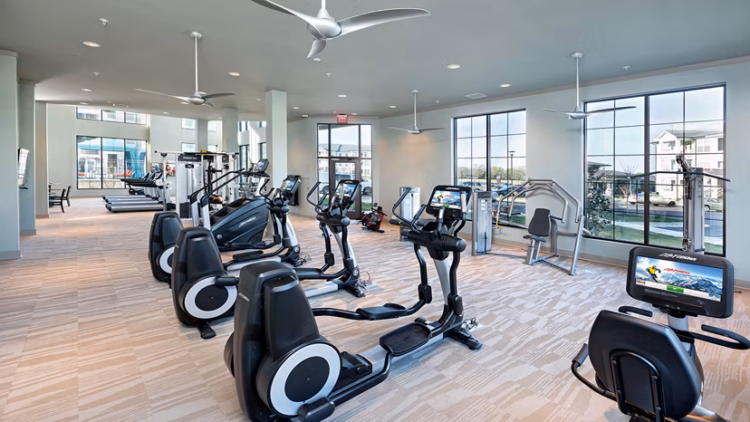 Modern fitness center with state-of-the-art equipment at Avia Apartments