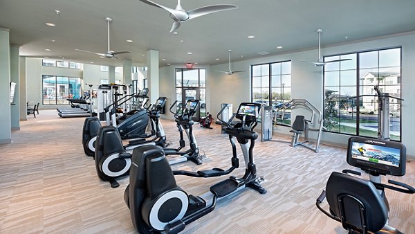 Modern fitness center with state-of-the-art equipment at Avia Apartments