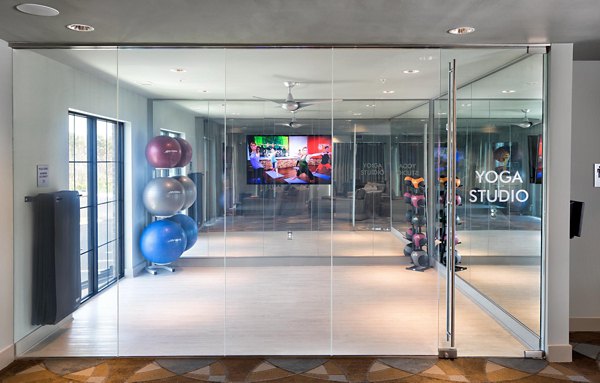 State-of-the-art fitness center with modern gym equipment at Avia Apartments