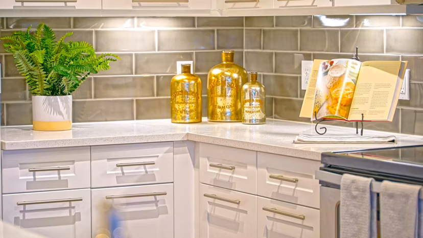 Modern kitchen with granite countertops and stainless steel appliances in Avia Apartments
