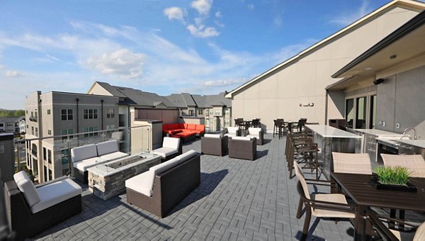 Spacious patio with cozy seating at Avia Apartments, ideal for outdoor relaxation