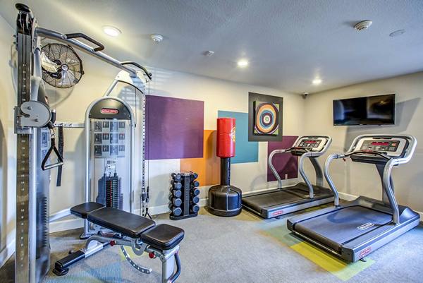 fitness center at The Huntington Apartments