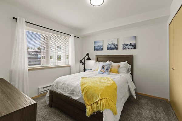 Cozy bedroom with modern decor at Destinations Lynnwood Apartments