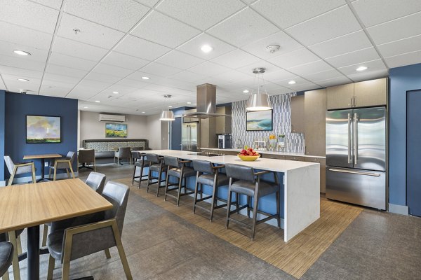 Game room with pool table and seating area at Destinations Lynnwood Apartments