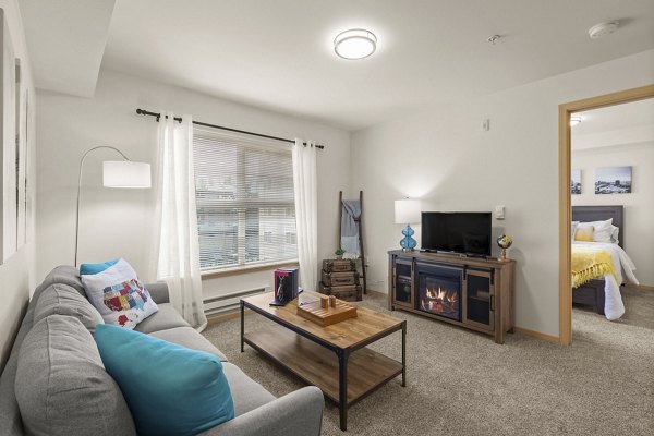 Spacious living room with modern furnishings at Destinations Lynnwood Apartments
