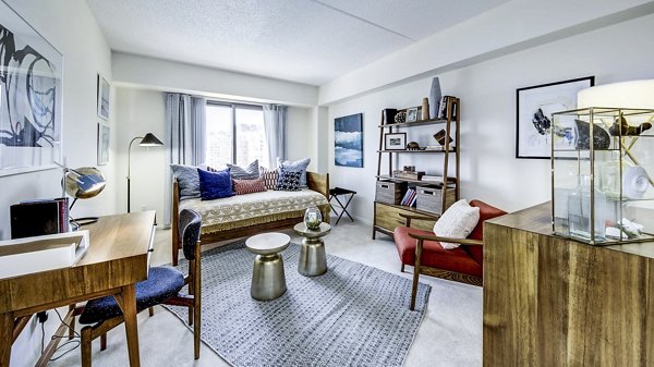 Bedroom featuring modern furnishings and waterfront views at Half Moon Harbour Apartments