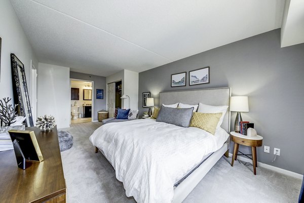 Inviting bedroom with serene views at Half Moon Harbour Apartments, offering luxury living by Greystar