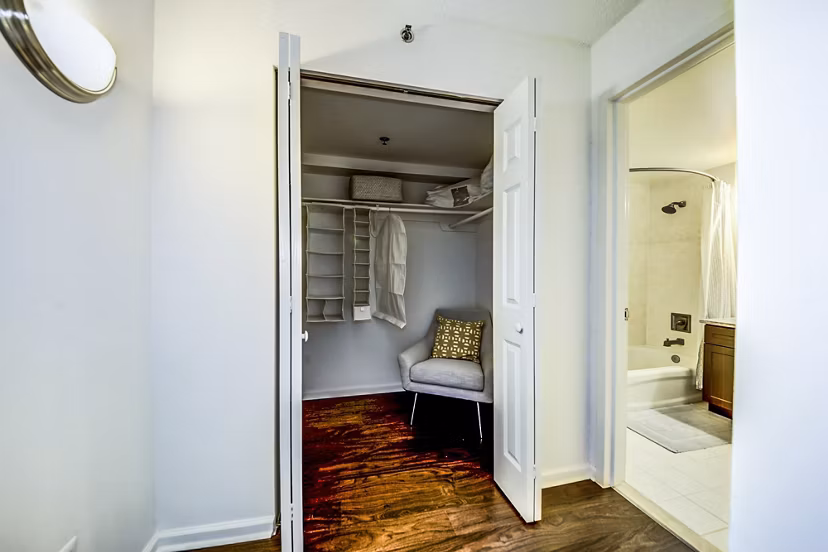 Walk-in closet with ample storage space at Half Moon Harbour Apartments