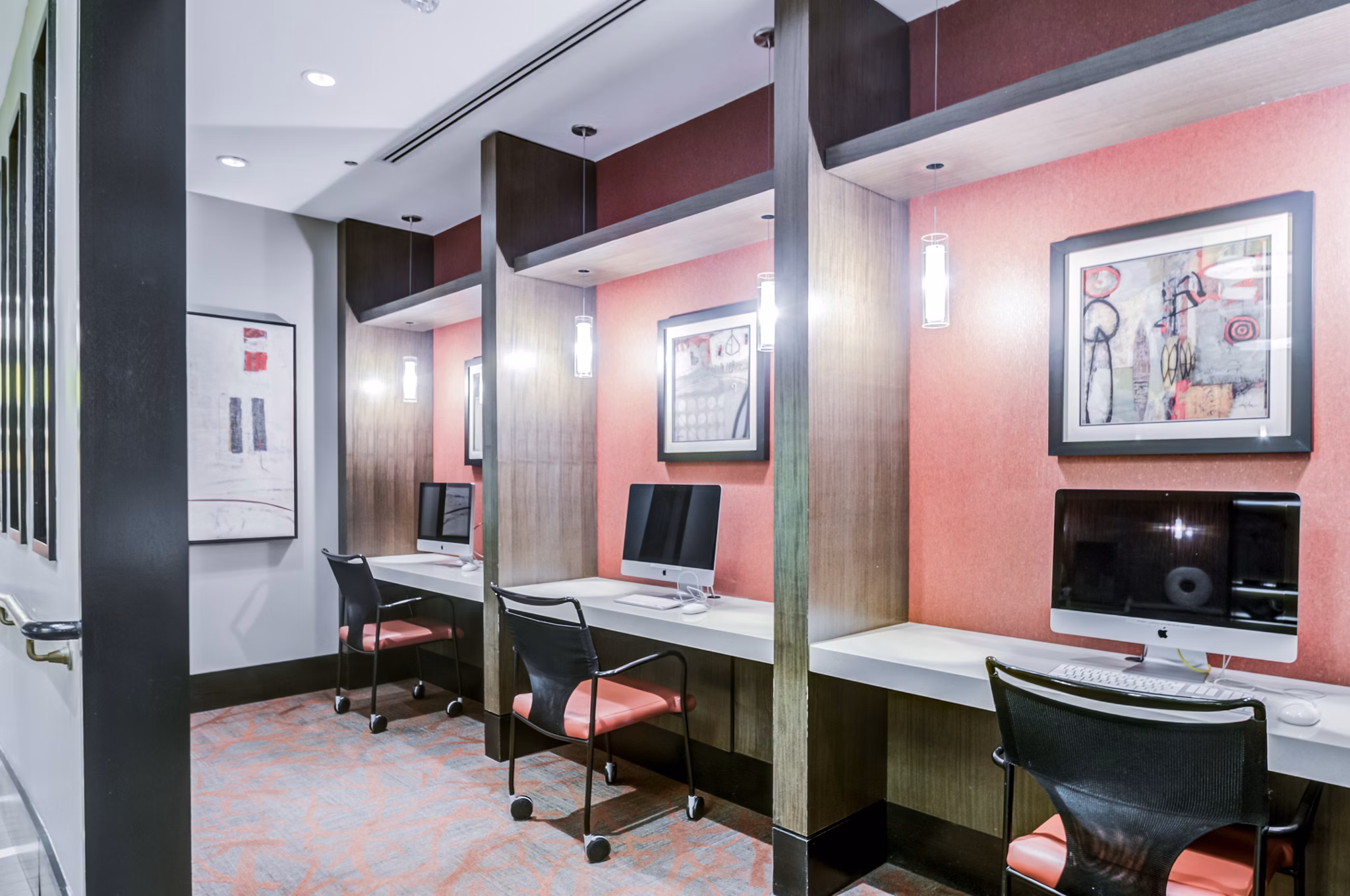 Modern business center with sleek workstations at Half Moon Harbour Apartments, ideal for productive meetings and remote work