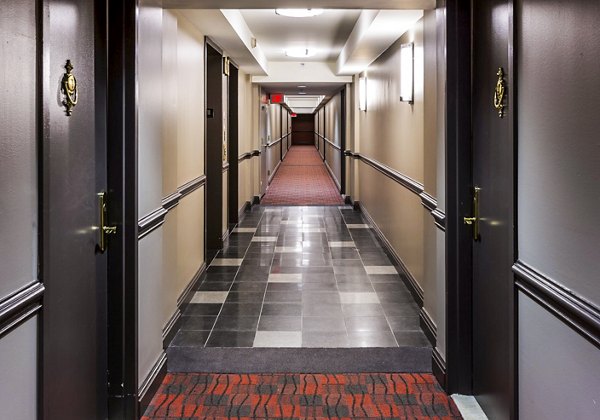 Spacious hallway with modern lighting fixtures in Half Moon Harbour Apartments, offering luxury living in a prime location