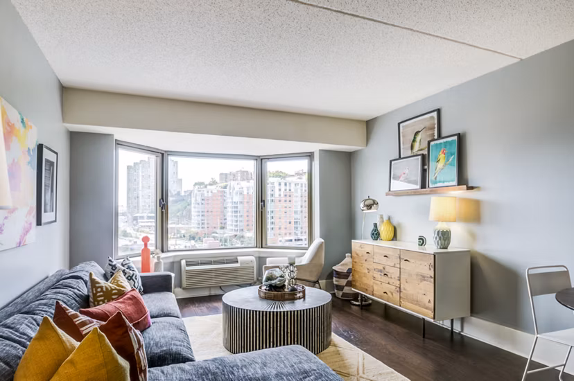 Spacious living room with modern decor in Half Moon Harbour Apartments