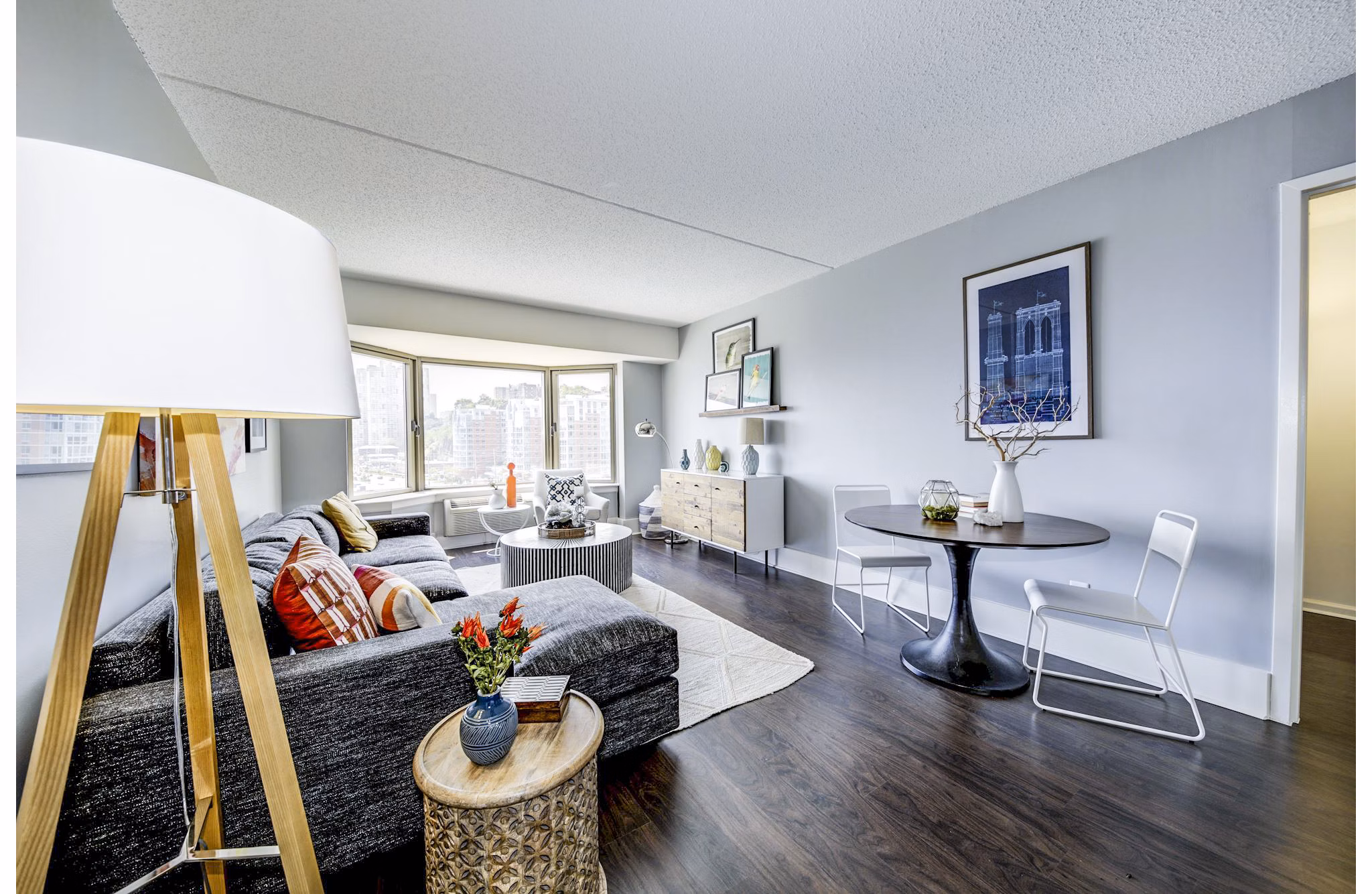 Modern living room with waterfront views at Half Moon Harbour Apartments