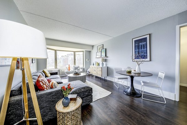 Modern living room with waterfront views at Half Moon Harbour Apartments