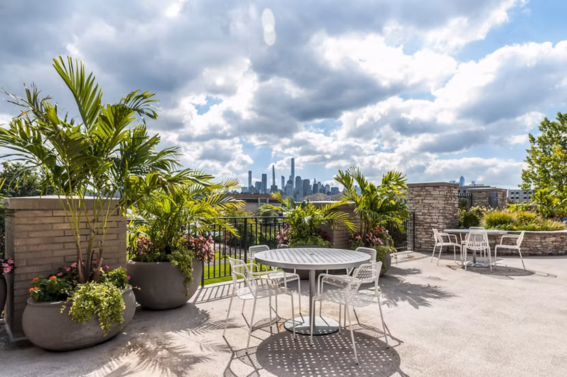 Spacious patio with river views at Half Moon Harbour Apartments, ideal for relaxation and entertainment