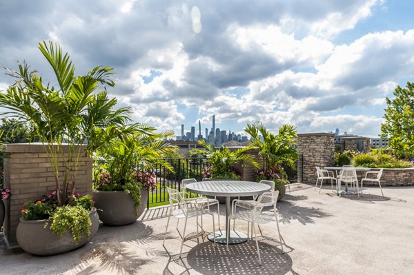 Spacious patio with river views at Half Moon Harbour Apartments, ideal for relaxation and entertainment