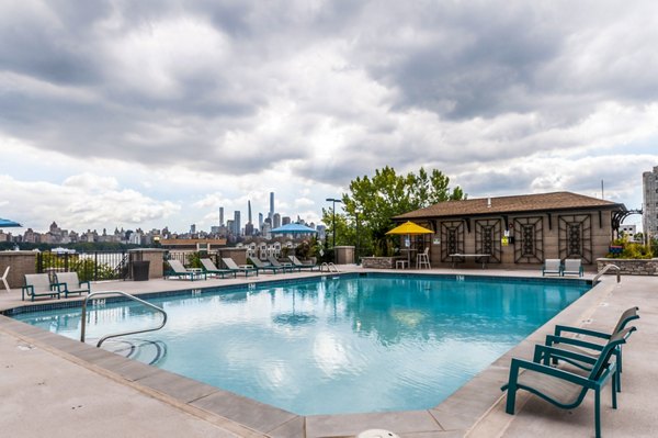 Outdoor pool with scenic views at Half Moon Harbour Apartments