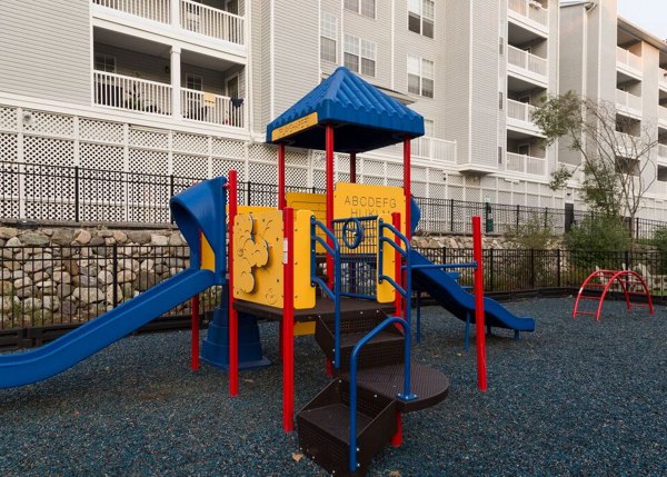 Family-friendly playground with modern equipment at Mountain View Crossing apartments