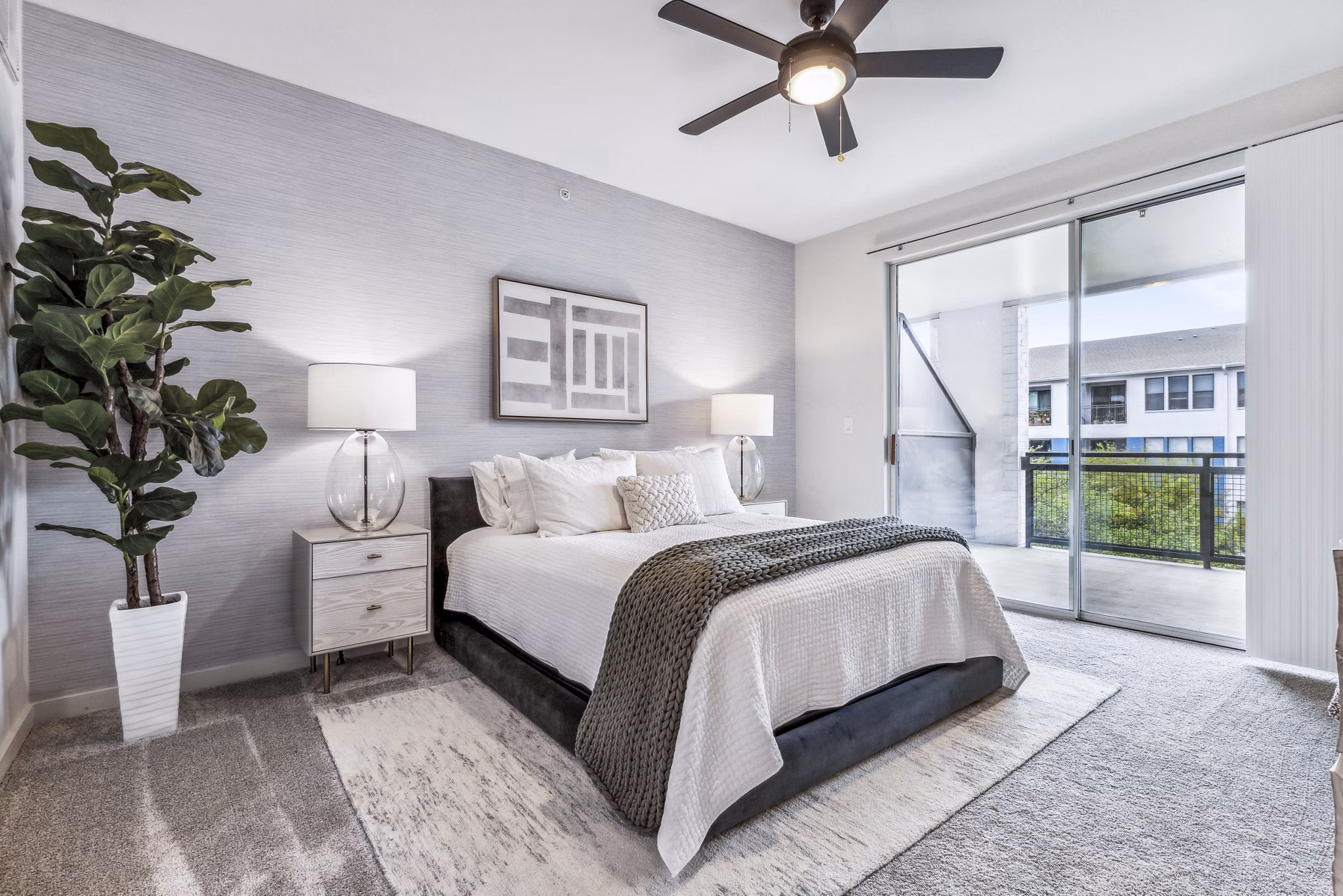 Cozy bedroom with modern furnishings at Broadstone on Trinity Apartments in luxury setting