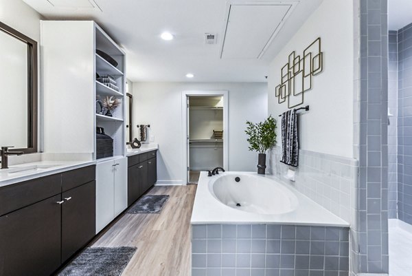 Contemporary bathroom with large vanity and sleek fixtures in Broadstone on Trinity luxury apartments