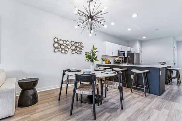 Elegant dining room with contemporary decor in Broadstone on Trinity Apartments, ideal for hosting guests and enjoying meals