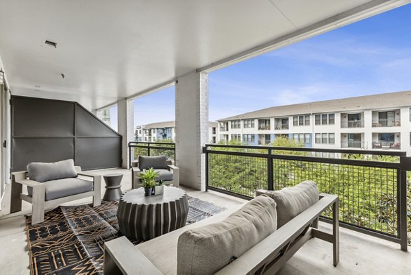 Cozy fire pit on patio at Broadstone on Trinity Apartments, ideal for relaxing evenings