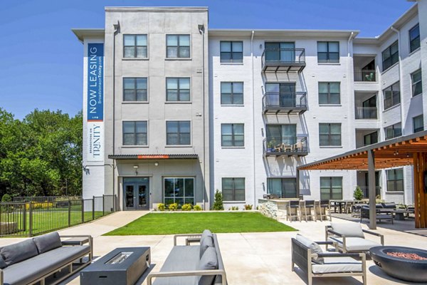 Fire pit patio at Broadstone on Trinity Apartments offering cozy outdoor seating and ambient lighting for luxury living in Austin