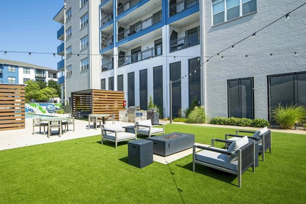 Outdoor grill area and fire pit on patio at Broadstone on Trinity Apartments, perfect for entertaining and relaxation