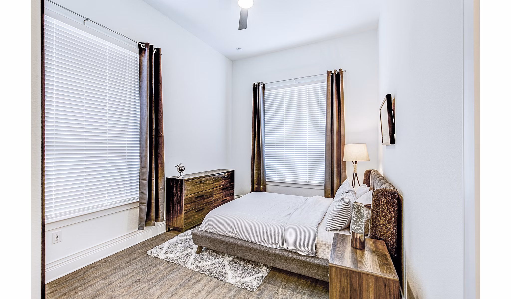 Modern bedroom with stylish decor at Elan Inwood Apartments, known for luxury living and contemporary design in the heart of the community